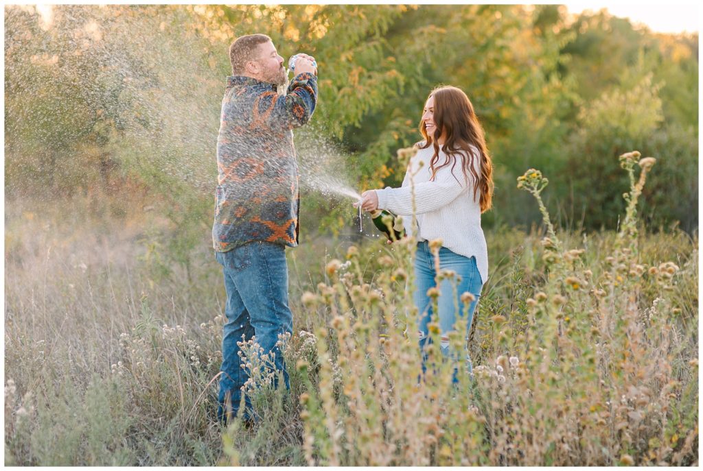 Romantic Engagement Photos at Great Plains Nature Center-Champagne Spray